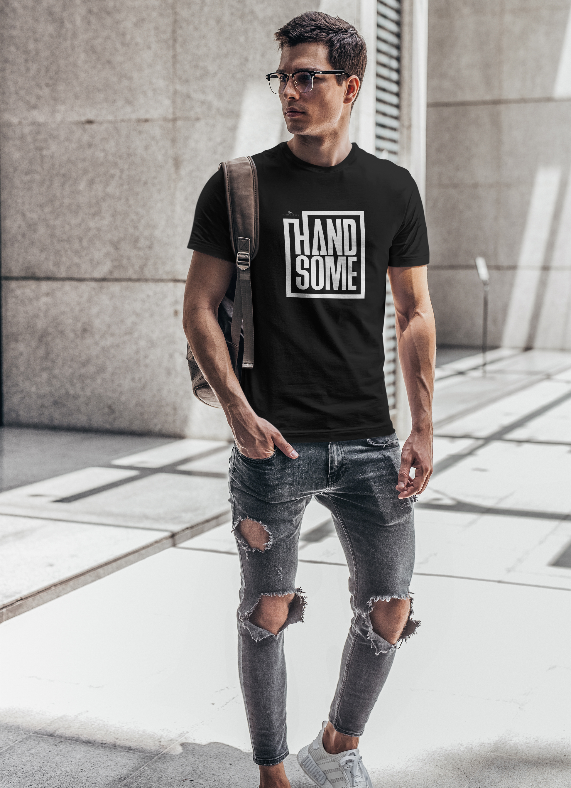 Guy walking wearing the Burke Avenue handsome t-shirt