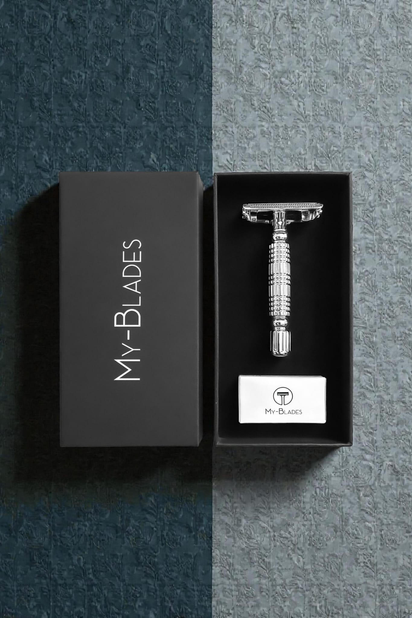 Stainless steel safety razor in a black box with 'My Blades' branding on a dark textured background