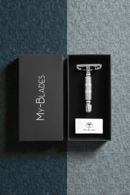 Stainless steel safety razor in a black box with 'My Blades' branding on a dark textured background